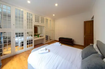 a bedroom with a white bed in a room at Flaminio District Holiday Home in Rome
