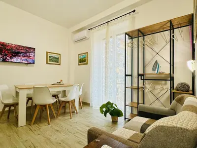 a living room with a couch and a table at Casa Flora in Rome