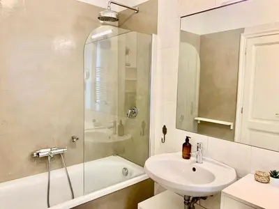 a bathroom with a sink and a shower and a tub at RomeAsYouLike - Trastevere Experience 20 in Rome