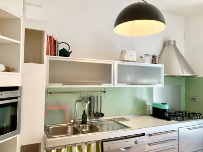 a kitchen with a sink and a lamp at RomeAsYouLike - Trastevere Experience 20 in Rome