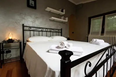 a bedroom with a bed with towels on it at Villa Aureliana with pool near San Peter in Rome