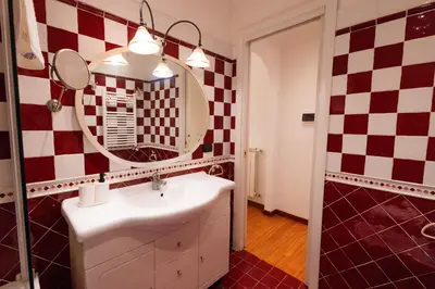 a bathroom with a sink and a mirror at Villa Aureliana with pool near San Peter in Rome