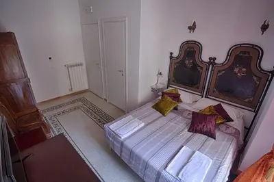 a bedroom with a large bed in a room at Vatican Leone IV in Rome