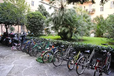 a row of bikes parked next to a wall at Vatican Leone IV in Rome