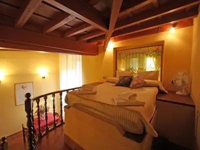 a bedroom with a bed with towels on it at Domus Navona Pantheon in Rome