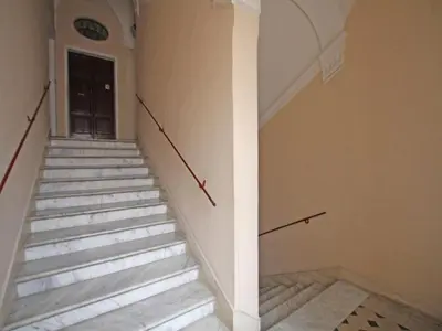 a set of stairs in a building with a door at Domus Navona Pantheon in Rome