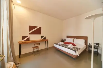 a bedroom with a bed with two towels on it at Roma Stazione Termini 300 mq appartamento con 4 camere vista e idromassaggio in Rome