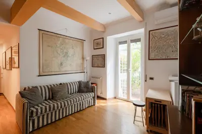 a living room with a couch and a fireplace at Francesco Terrace - Piazza Bologna, Rome in Rome