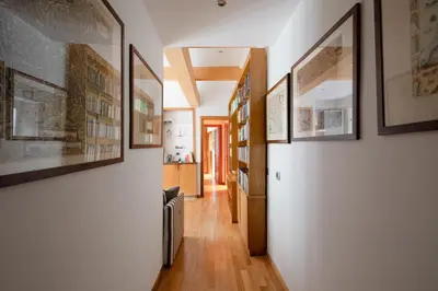 a hallway with pictures on the walls of a house at Francesco Terrace - Piazza Bologna, Rome in Rome