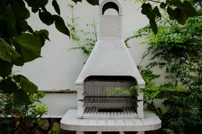 a bird bath sitting on a bench in a garden at Francesco Terrace - Piazza Bologna, Rome in Rome