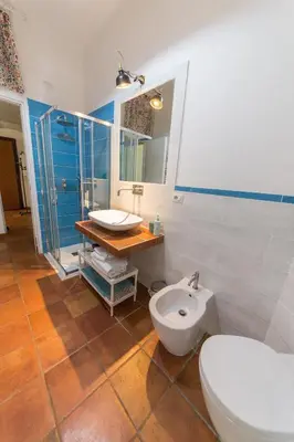 a bathroom with a toilet and a sink at Irnerio house in Rome