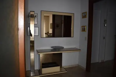 a bathroom with a sink and a mirror at Vacanze Romane in Rome
