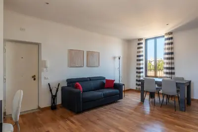 a living room with a couch and a table at GuestHost - MM San Giovanni Apartment in Rome
