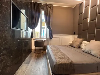 a bedroom with a bed and a window at Lary's - Vaticano in Rome