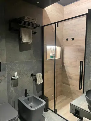 a bathroom with a shower and a toilet and a sink at Lary's - Vaticano in Rome