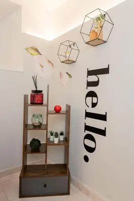 a room with a shelf with plants on the wall at Casa ZOE in Rome