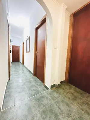 an empty hallway with two doors and a tile floor at Bella Roma Stay in Rome