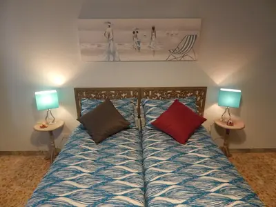 a bedroom with a bed with two lamps on two tables at Affittacamere Roma Centro, Musei Vaticani Rooms in Rome