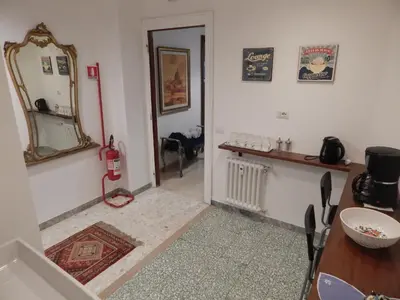 a living room with a mirror and a table at Affittacamere Roma Centro, Musei Vaticani Rooms in Rome