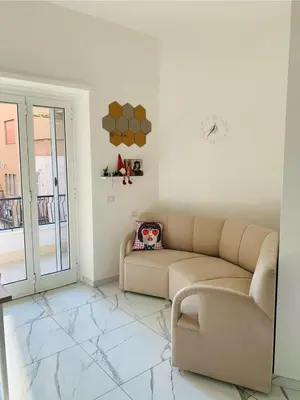 a living room with a couch and a window at B&Baldo Vatican in Rome