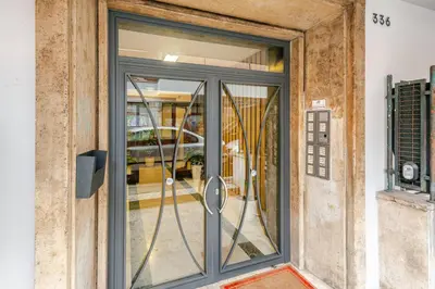 an entry door to a building with a window at B&Baldo Vatican in Rome