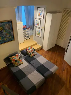a couch sitting in the middle of a living room at La casa di Barcri in Rome