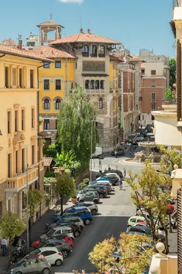 a city street with cars parked in a parking lot at Coppede' Penthouse in Rome