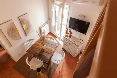 an overhead view of a living room with a table and a tv at Pantheon Splendid Flat with Terrace in Rome