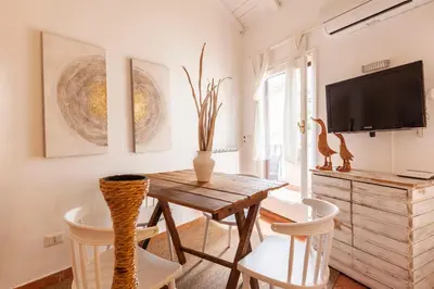 a dining room with a wooden table and chairs at Pantheon Splendid Flat with Terrace in Rome