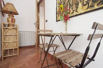 a room with a desk and a chair and a table at La Casa dei Quattro Venti in Rome