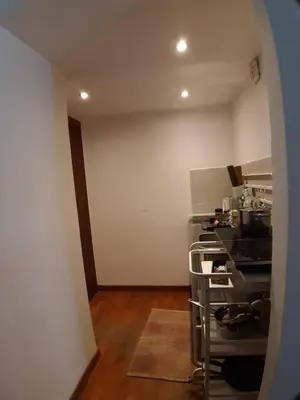 a room with a kitchen with a stove top oven at La Casa dei Quattro Venti in Rome