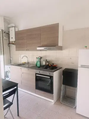 a kitchen with a stove and a counter top at Lisa HOUSE in Rome