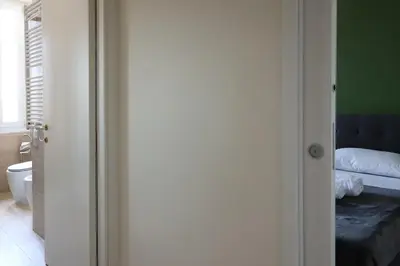 a door to a bedroom with a bed in it at Vatican Jacuzzi House in Rome