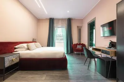 a hotel room with a bed and a desk at My Rooms in Vatican City in Rome