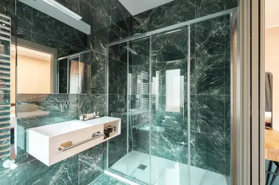 a bathroom with a sink and a shower at My Rooms in Vatican City in Rome