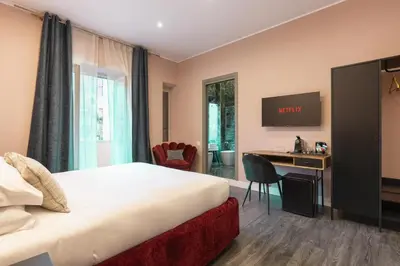 a hotel room with a bed and a desk at My Rooms in Vatican City in Rome