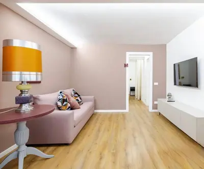 a living room with a couch and a table at EppyTime Roma in Rome