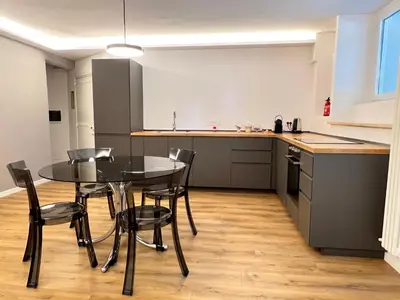 a kitchen and dining room with a table and chairs at EppyTime Roma in Rome