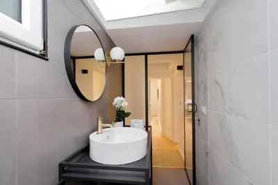 a bathroom with a sink and a mirror at EVE Guest House at Trevi Fountain in Rome