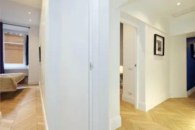 a hallway with a door leading to a bedroom at EVE Guest House at Trevi Fountain in Rome