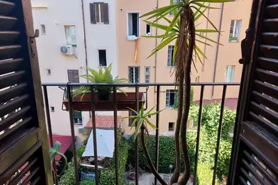 a balcony with a view of a building at Leonina Terrace - My Extra Home in Rome