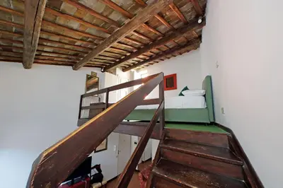 a staircase in a room with a bunk bed at Leonina Terrace - My Extra Home in Rome