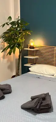 a bedroom with a bed with towels on it at Alloggio turistico Gloria in Rome
