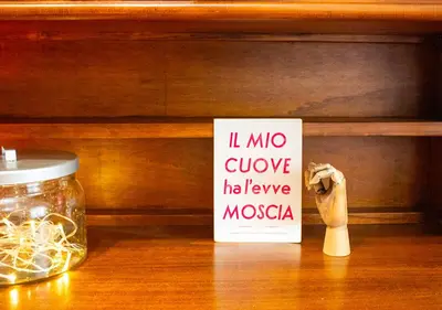 a sign that says i mo glucose have moxica next to a jar at Luminoso a due passi da Piazza Bologna in Rome