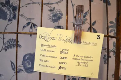 a sign for a barberber shop on a wall at Babbo Guest House in Rome