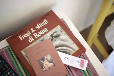 a book sitting on top of a table at Trastevere Dream House in Rome