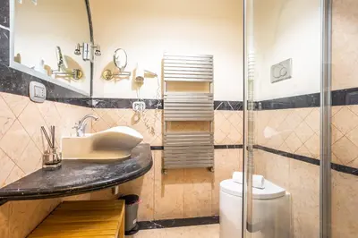 a bathroom with a sink and a shower at Opera Theater Relais in Rome