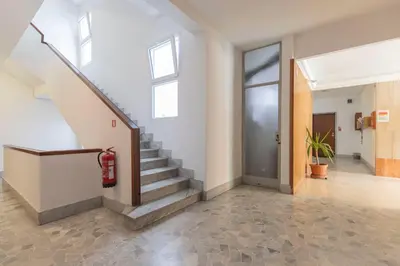 a hallway with stairs in a building at Casa Lilly, appartamento luminosissimo a Roma in Rome