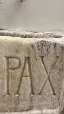 a stone block with the word race written on it at PAX apartment in Rome