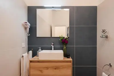 a bathroom with a sink and a mirror at PAX apartment in Rome